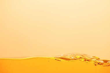 smooth yellow bright liquid isolated on yellow clipart