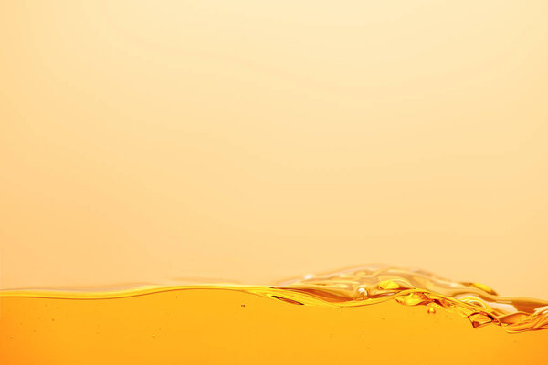 smooth yellow bright liquid isolated on yellow