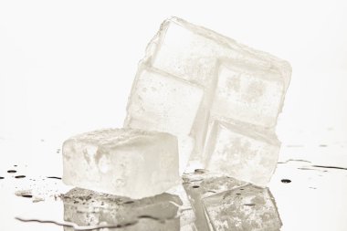 stack of transparent melting ice cubes on white background clipart