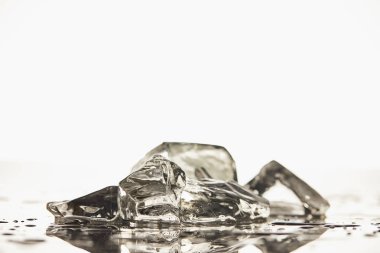 stack of transparent melted ice cubes on white background clipart