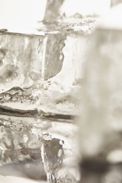 close up view of pure transparent wet textured ice cubes