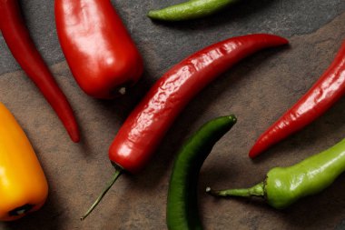 top view of Mexican spicy chili peppers on stone table clipart