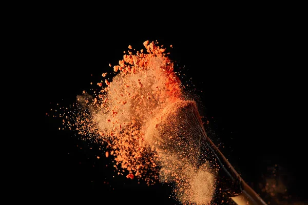 Cosmetic Brush Colorful Orange Powder Explosion Black Background — Stock Photo, Image