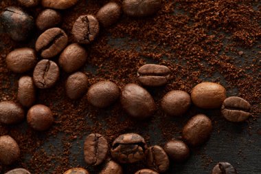 Aromatic roasted coffee beans mixed with ground coffee clipart