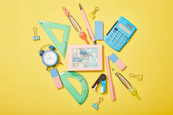 Top View School Supplies Scattered Box Clips Yellow Background — Stock Photo, Image