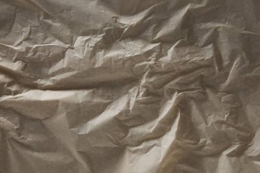 top view of beige wrinkled parchment paper surface with copy space clipart
