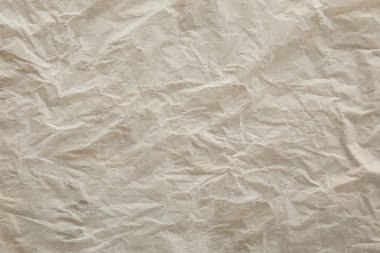 top view of beige crumped parchment paper surface with copy space clipart