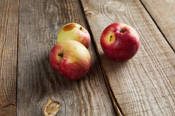 Apples Rotten Spot Brown Wooden Surface — Stock Photo, Image