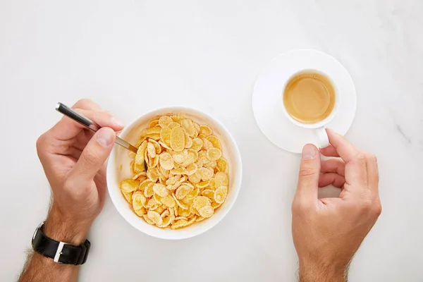 Cropped Image Man Holding Cup Coffee Spoon Bowl Cornflakes White — Stock Photo, Image