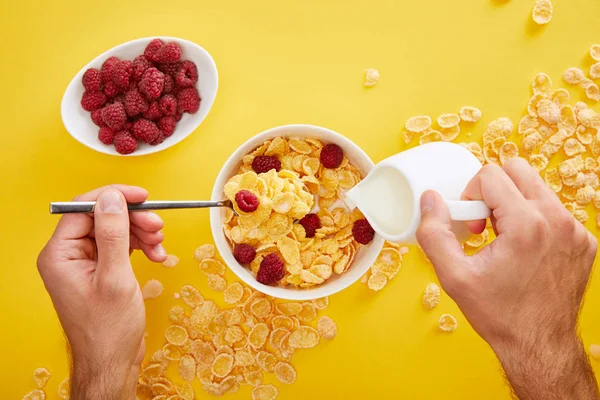 Cropped View Man Pouring Milk Bowl Cornflakes Isolated Yellow — Stock Photo, Image
