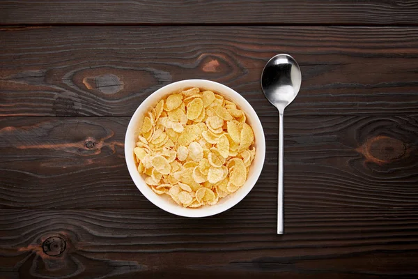 Top View Spoon Cornflakes Bowl Wooden Surface — Stock Photo, Image