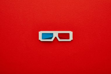 top view of 3d glasses on red background clipart