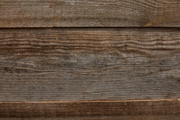 風化した茶色のテクスチャード木製の背景のトップビュー — ストック写真
