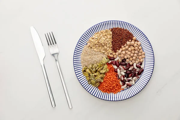 Top View Fork Knife Striped Plate Raw Lentil Chickpea Quinoa — Stock Photo, Image