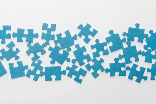 Top View Scattered Pieces Blue Jigsaw Puzzle White Background — Stock Photo, Image