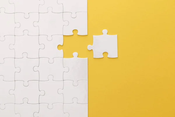 Top View White Jigsaw Puzzle Yellow Background — Stock Photo, Image
