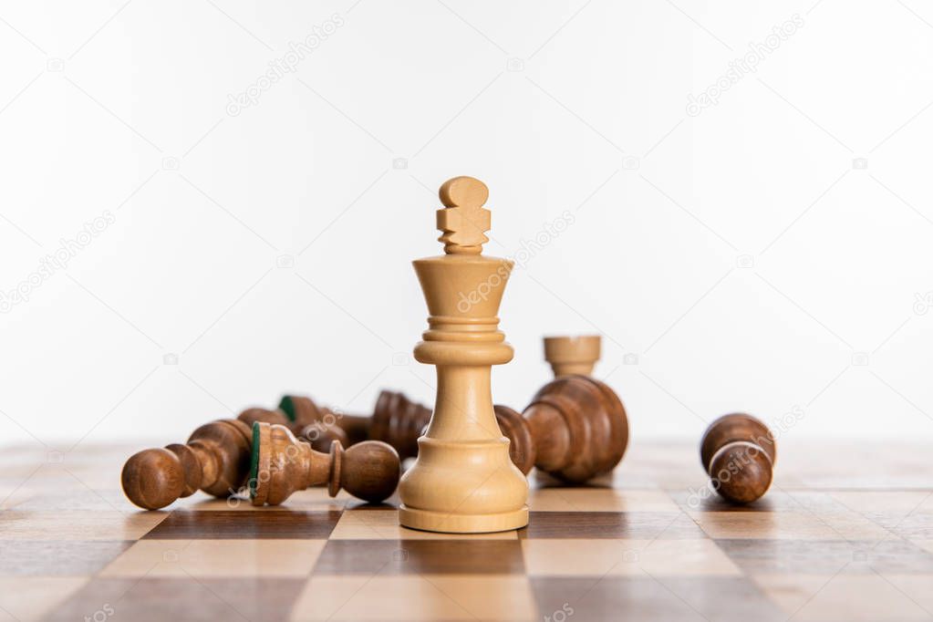 black and white chess figures on chessboard isolated on white
