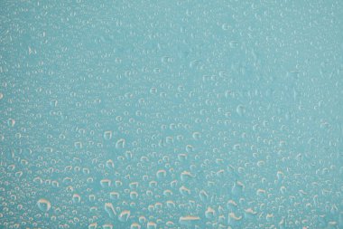clear transparent water drops on blue background clipart