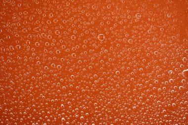 clear transparent water drops on orange background clipart