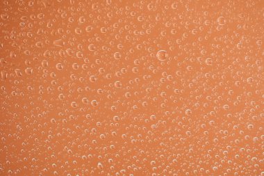 clear transparent water drops on beige background clipart