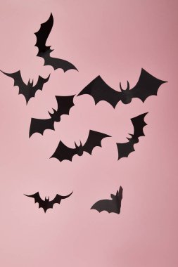 black paper bats on pink background, Halloween decoration clipart