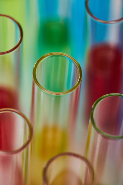 close up view of glass test tubes with colorful liquid