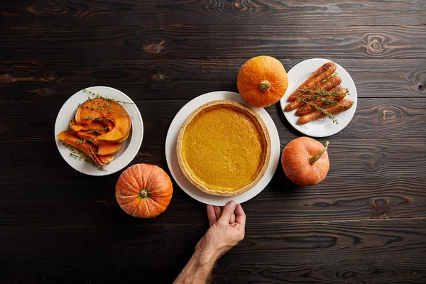 Partial View Male Hand Plate Pumpkin Pie Baked Whole Carrot — Stock Photo, Image