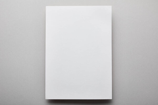top view of empty and white paper with copy space 