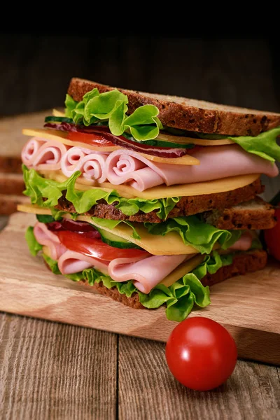 Fresh Sandwich Lettuce Ham Cheese Bacon Tomato Wooden Cutting Board — Stock Photo, Image
