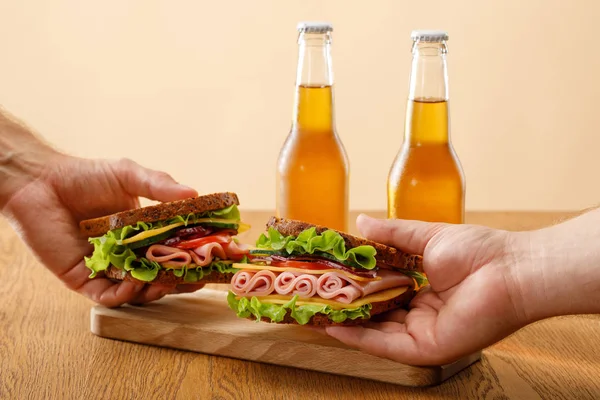 Cropped View Men Holding Fresh Sandwiches Lettuce Ham Cheese Bacon — Stock Photo, Image
