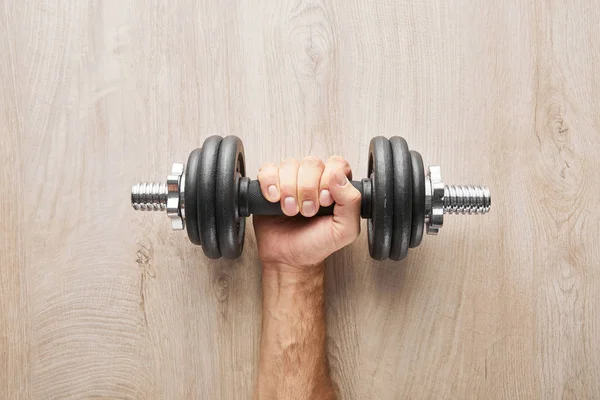 Top View Sportsman Holding Dumbbell Wooden Surface — Stock Photo, Image