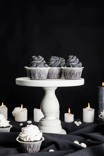 Tasty Halloween Cupcakes Black Cream White Stand Burning Candles Isolated — Stock Photo, Image