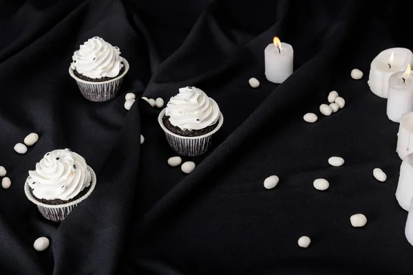 Tasty Halloween Cupcakes White Cream Burning Candles Black Cloth — Stock Photo, Image