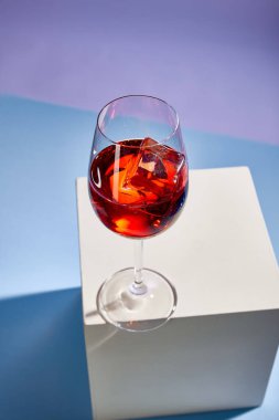 high angle view of cocktail Aperol Spritz in glass on blue background  clipart