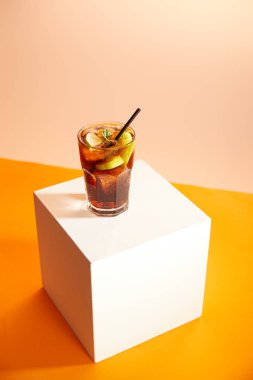 cocktail cuba libre in glass with straw on cube   clipart