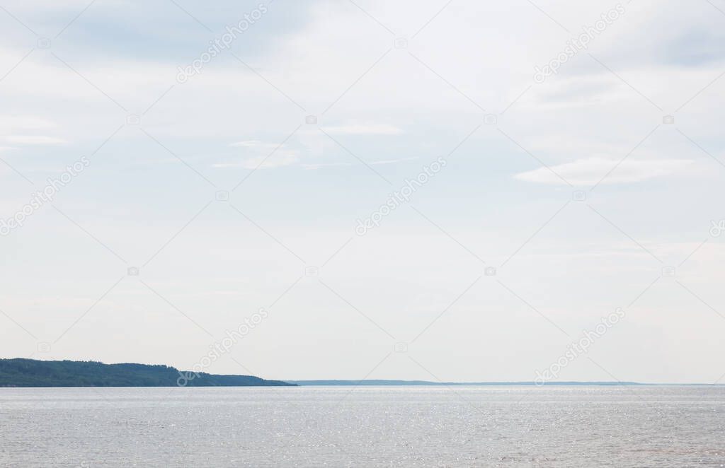 tranquil blue sea against sky with clouds 