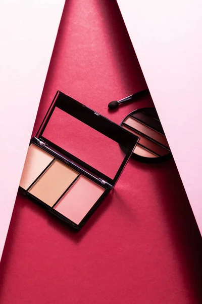 Pastel eye shadow and blush palettes near eyeshadow aplacator on pink and crimson — Stock Image Pastel Eye Shadow Blush Palettes Eyeshadow Aplacator Pink Crimson Royalty Free Stock Photos