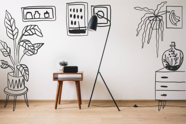 floor lamp, wooden coffee table and clock with blank screen near drawn plants, paintings and dresser  clipart