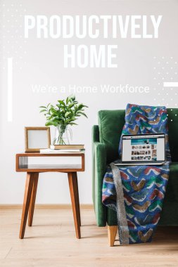 KYIV, UKRAINE - APRIL 14, 2020: productively home, were a home workforce lettering near green sofa, blanket, laptop with amazon website and coffee table  clipart