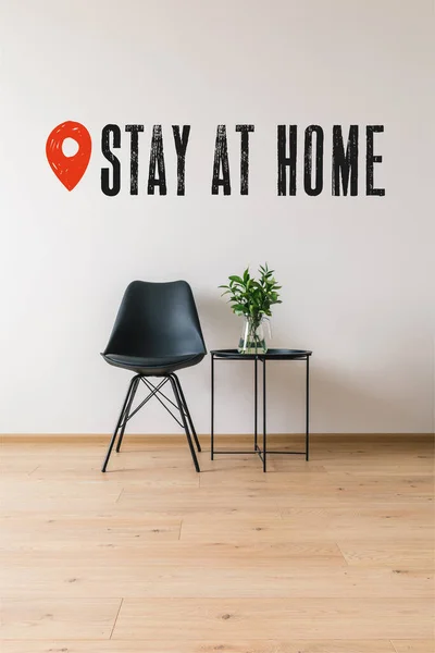 Black Coffee Table Green Plant Modern Chair Stay Home Lettering — Stock Photo, Image