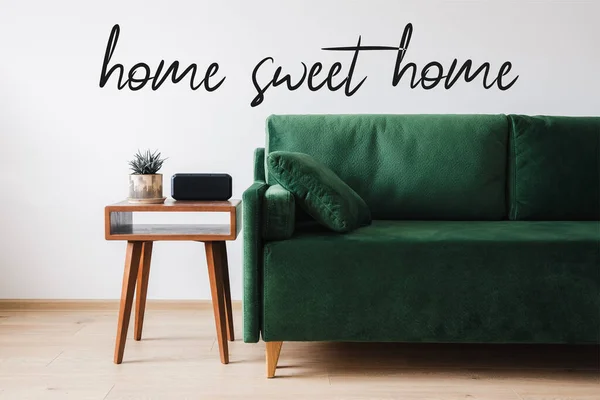 Green Sofa Pillow Wooden Coffee Table Plant Alarm Clock Home — Stock Photo, Image