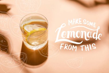 glass of fresh water with lemon slices on beige with make some lemonade from this lettering  clipart