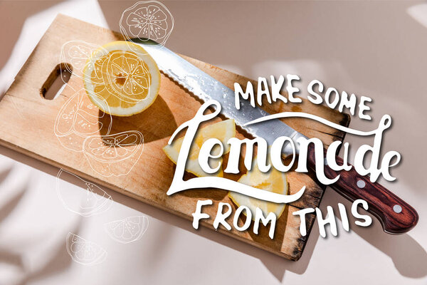 cutted lemon on wooden board on grey table with make some lemonade from this lettering