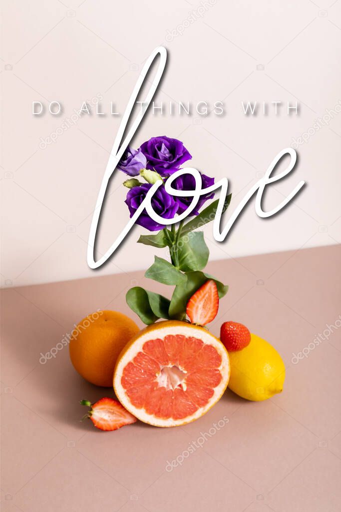 floral and fruit composition with purple eustoma and summer fruits near do all things with love lettering on beige