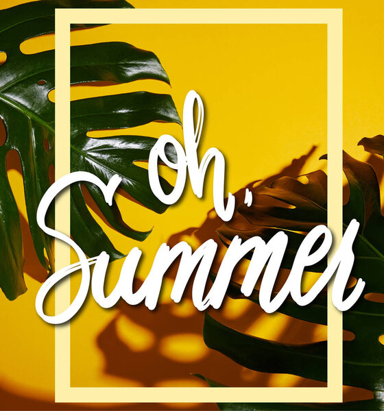 top view of tropical green leaves on yellow background with oh summer illustration