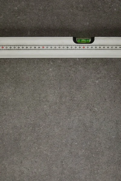 View from above of spirit level on gray surface — Stock Photo