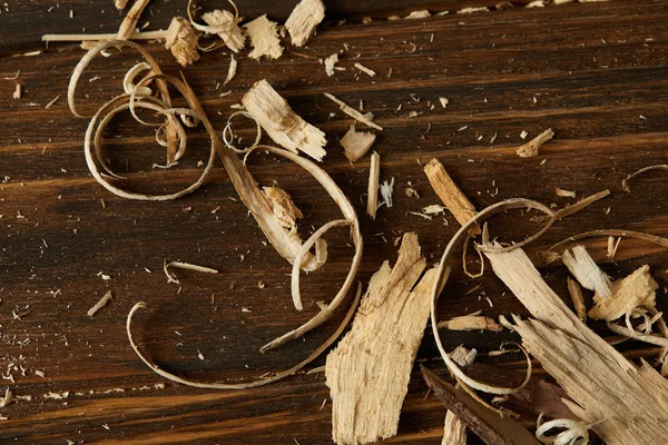 View from above of wooden chips on brown table — Stock Photo