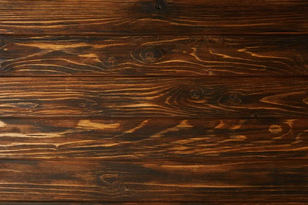 Vue de dessus du fond en bois brun avec planches horizontales — Photo de stock
