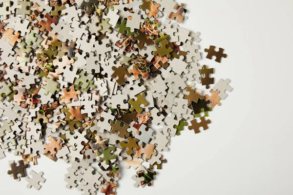Top view of jigsaw puzzle pieces with copy space on grey — Stock Photo