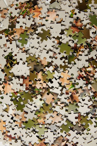 Top view of jigsaw puzzle pieces background — Stock Photo